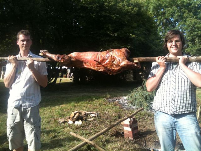 Me (right) and my brother with the cooked lamb.